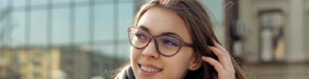 Girl wearing coat scarf and glasses